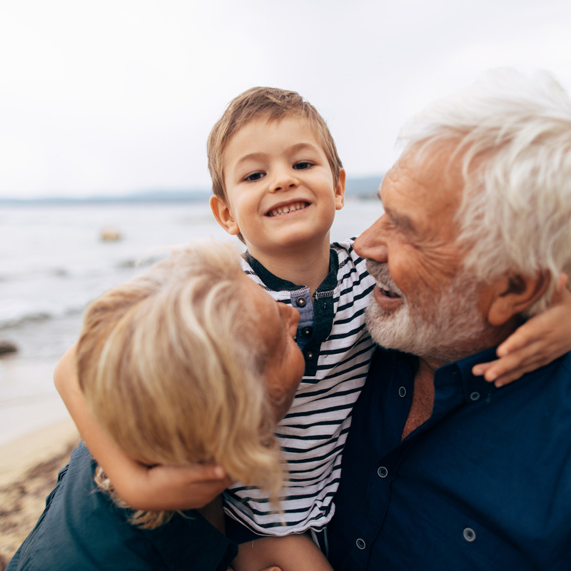 Grand parents cuddle their Grandson